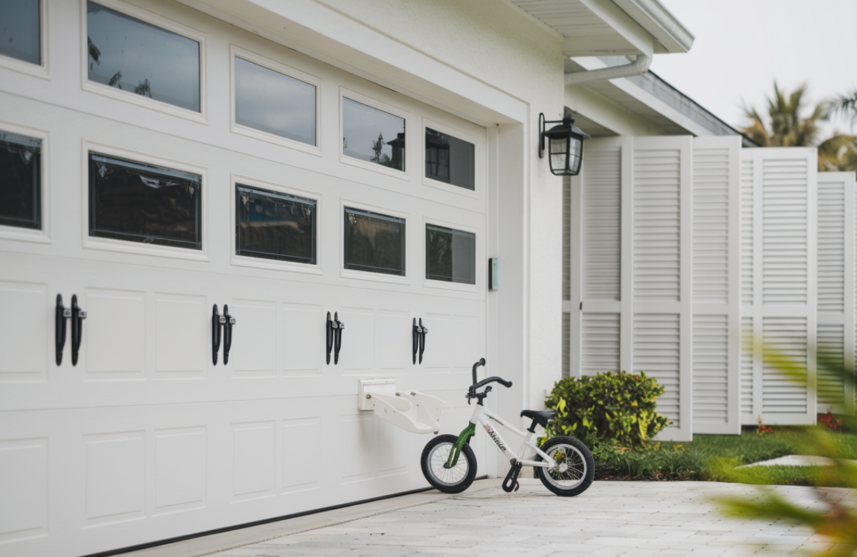 Jacksonville garage door with working safety sensors stopping for obstacle, showing crucial child protection feature